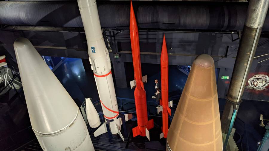 Looking down on a collection of tall missiles