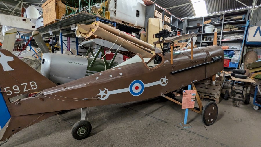 The fuselage of a brown-painted British WW1 fighter