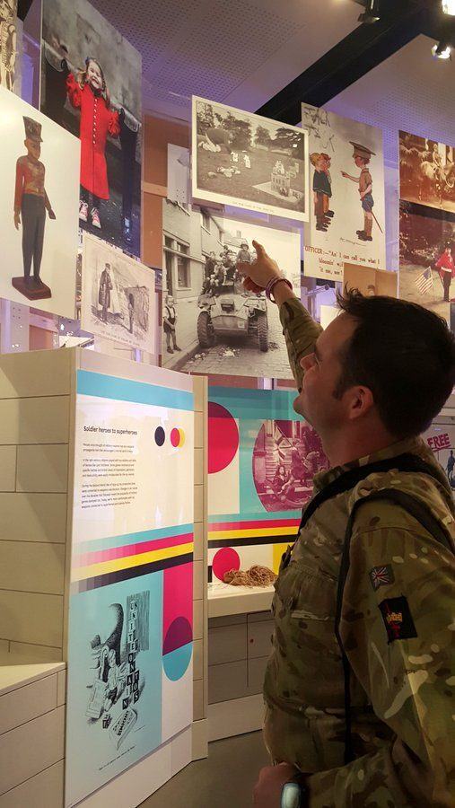 Soldier pointing in the Society Gallery photo at the National Army Museum