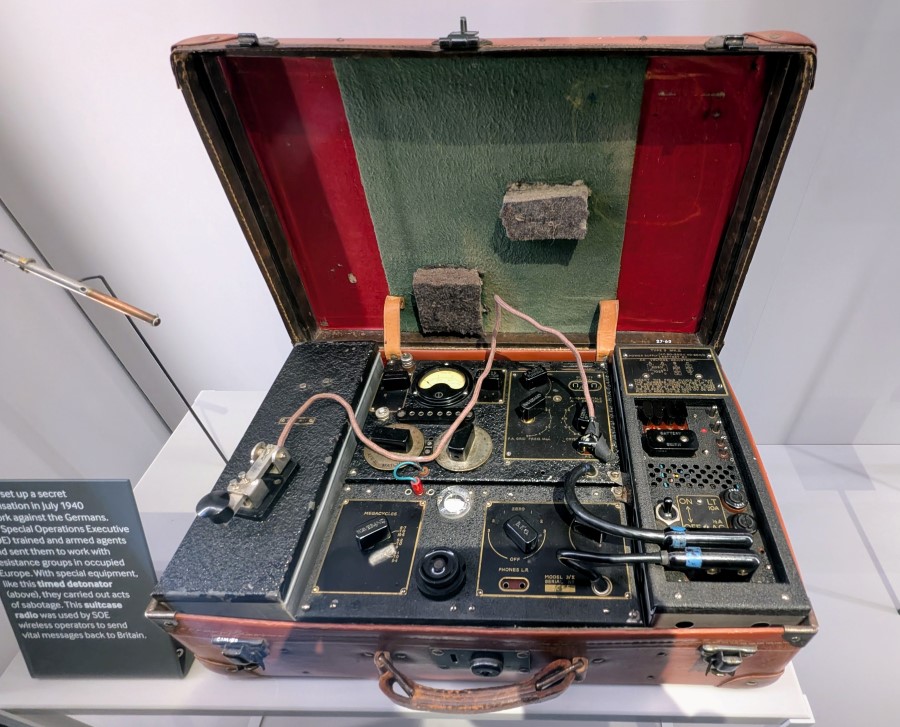 A leather suitcase with a radio set in it.