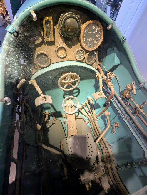 View of the cockpit of the SSB. Lots of dials and brass levers & wheels!