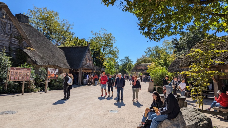 Visitors stroll past the fast food outlets in the village of Saint-Philbert-le-Vieil