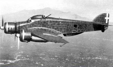 Old B/W photo of a Savoia-Marchetti SM.79 in flight