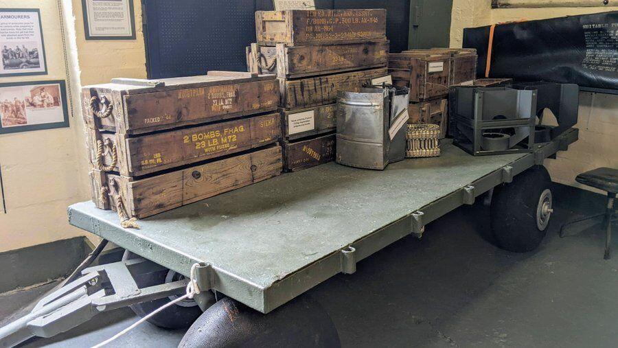 Flatbed trolley with boxes of ammunition on it