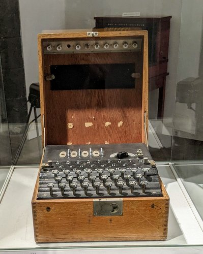 A German Enigma coding machine looking like a typewriter in a wooden box