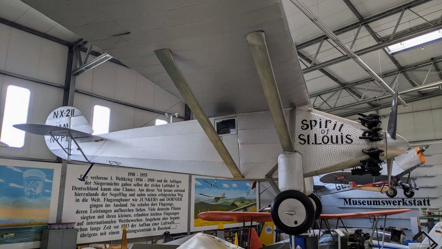 Silver monoplane, with no windscreen (Lindbergh had to glance out of the side window!)