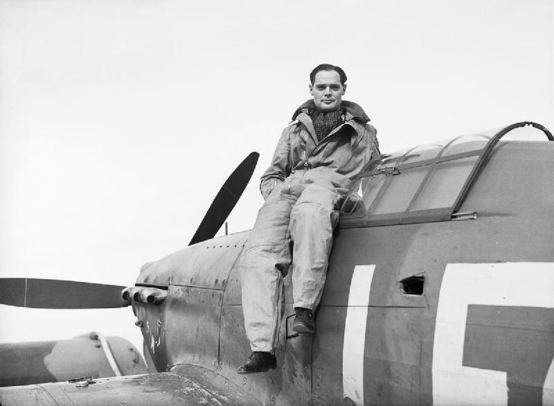 SL Douglas Bader sat on his Hurricane fighter aircraft
