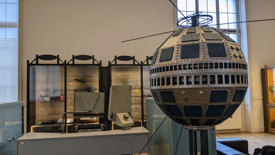 A model of the football-shaped blue and silver Telstar satellite on top of a display plinth.