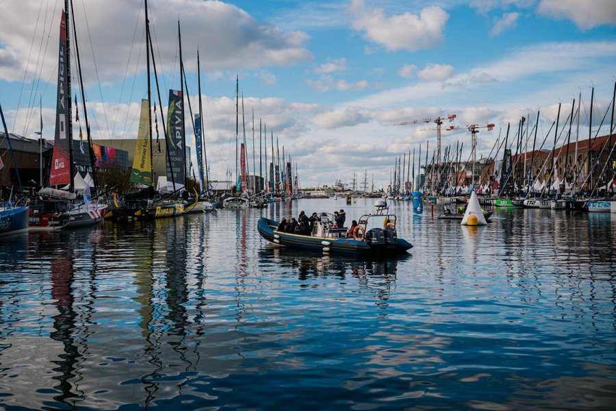 A RIB motors between rows of Transat Jacques Vabre race yachts in Le havre