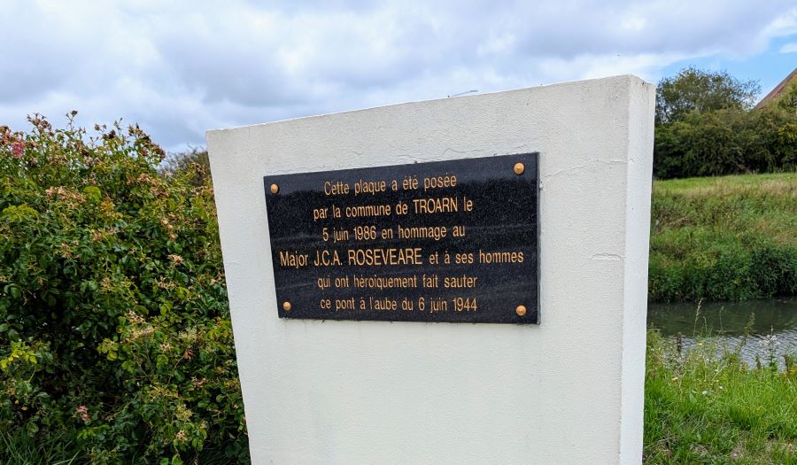 Close up of the plaque recording Major Roseveare's "heroic" destruction of the Troarn bridge