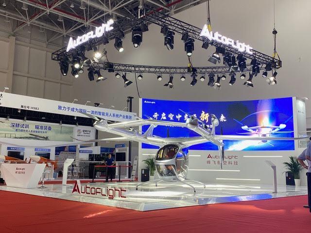 Futuristic V1500M eVTOL aircraft on a stand at the China Airshow