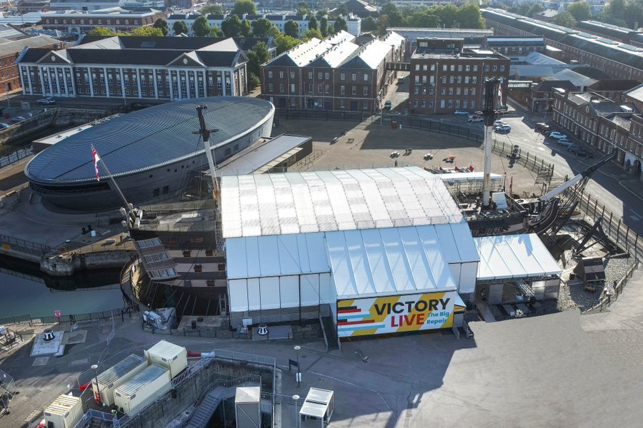 A large white tent covers HMS Victory