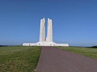 The white stone Canadian National Vimy Memorial memorial set against a blue sky