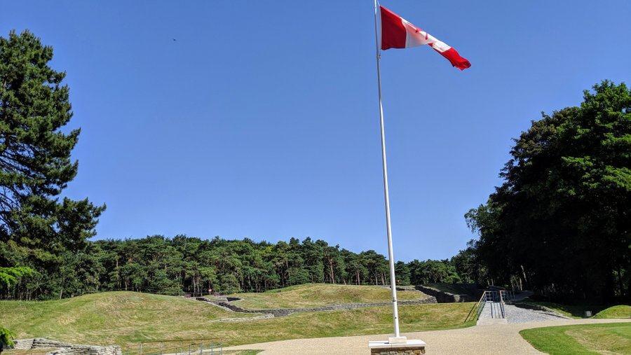 View of the Canadian flag and trenches
