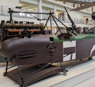 Brown painted fuselage of a WW1 biplane displayed in the Air & Space Museum, Le Bourget