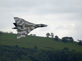 Vulcan flying past hills in Wales