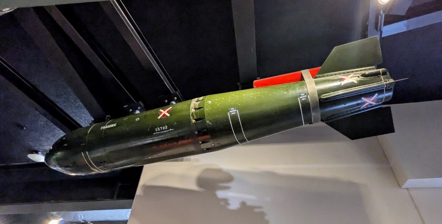 Large green bomb suspended from the IWM ceiling