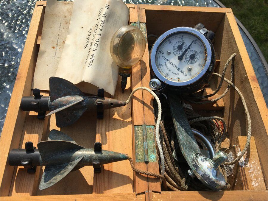 An old trailing log in a wooden box with two spinners