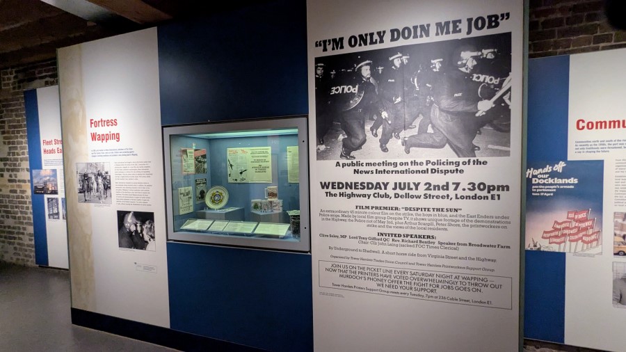 Info board with a large photo of riot police at the Wapping strike