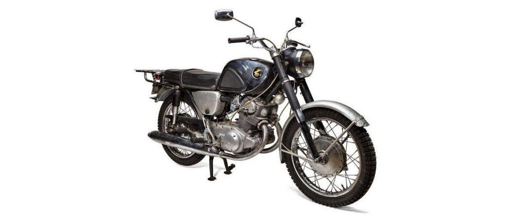 An old Honda motorcycle on a white background
