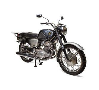 An old Honda motorcycle on a white background