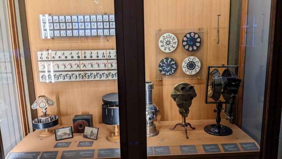 A display cabinet with various artefacts relating to the development of the moving image