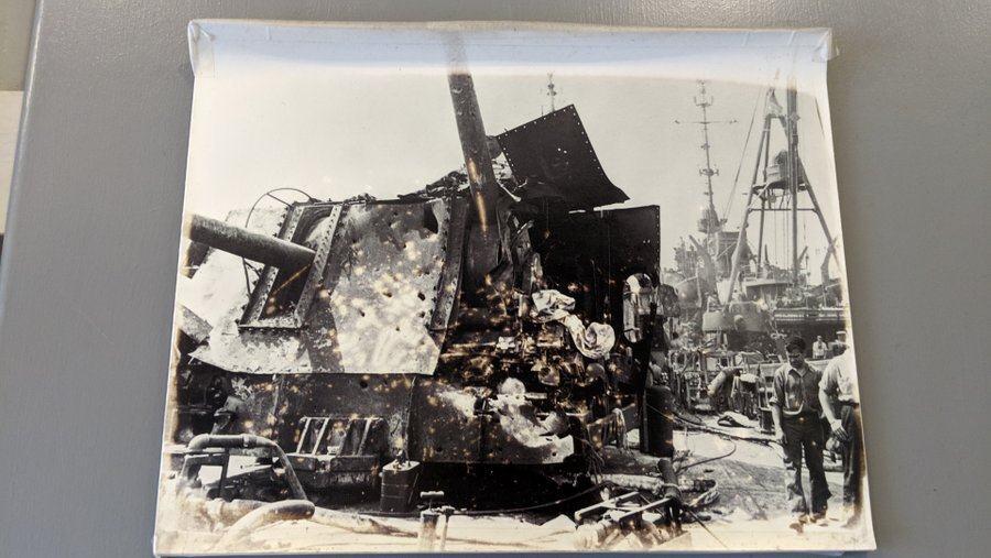 Black & white photo of badly damaged gun turret