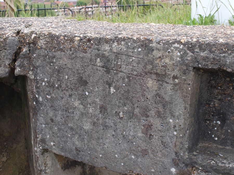 The date 1944, barely visible, scratched in the concrete
