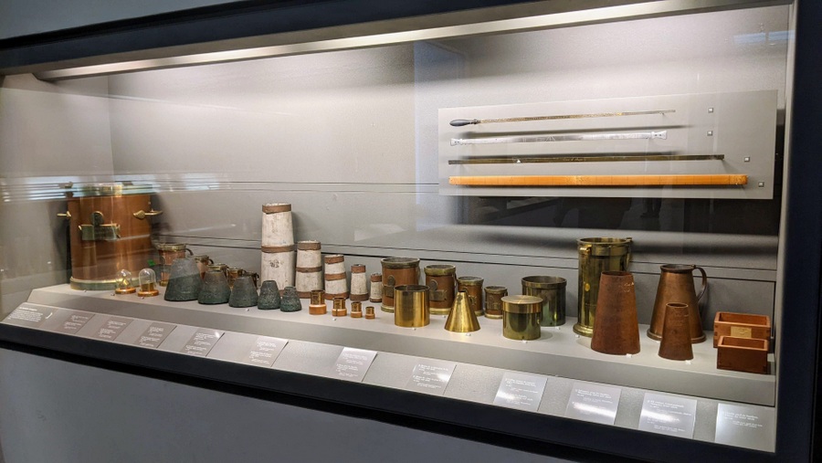 Display case with some rules and jugs for standardising volumes