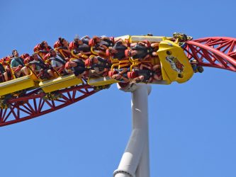 People on a roller-coaster hanging upside down as their cart spins