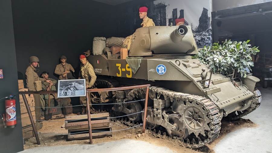 A diorama with an armoured self-propelled short barrel howitzer and its Free French crew somewhere in Tunisia