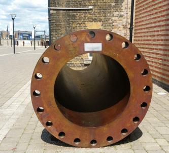 A large steel tube, slightly rusty