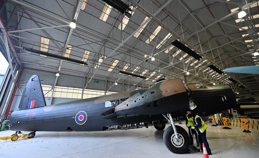 Restored Wellington bomber in green/brown camouflage in the display hanger at the RAF Museum, Cosford